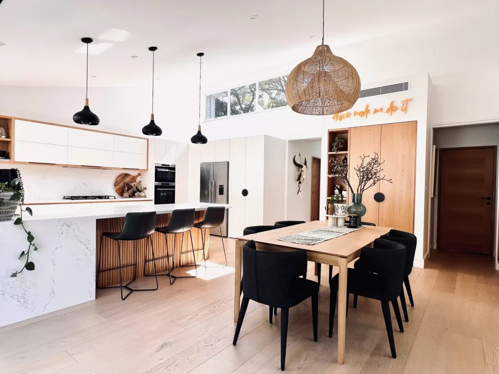 Open plan dining kitchen in Manly Vale with feature black seating