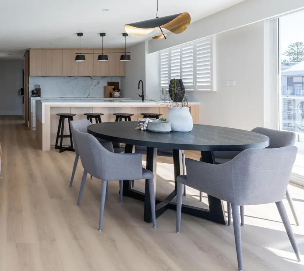 Dining chairs and bar stools in an open plan apartment in Manly, Northern Beaches