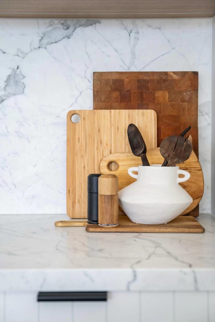 Styled arrangement of chopping boards and utensil holder in a completed northern beaches kitchen design