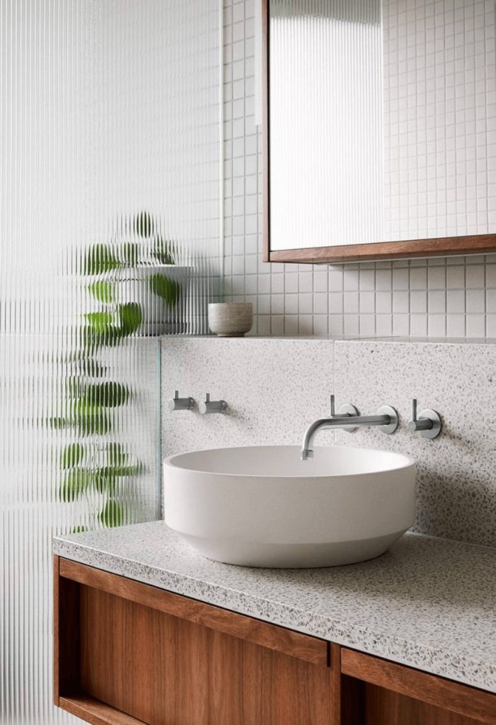 White basin with chrome tapware