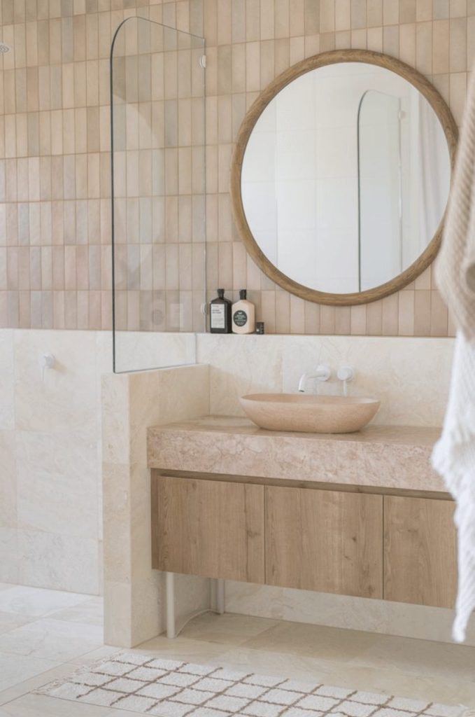White taps in a soft pink bathroom