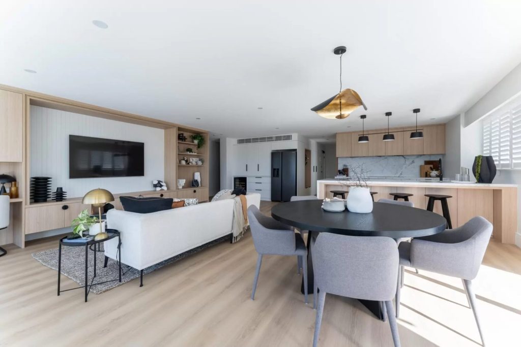 Coastal style open plan living area in an apartment in manly.