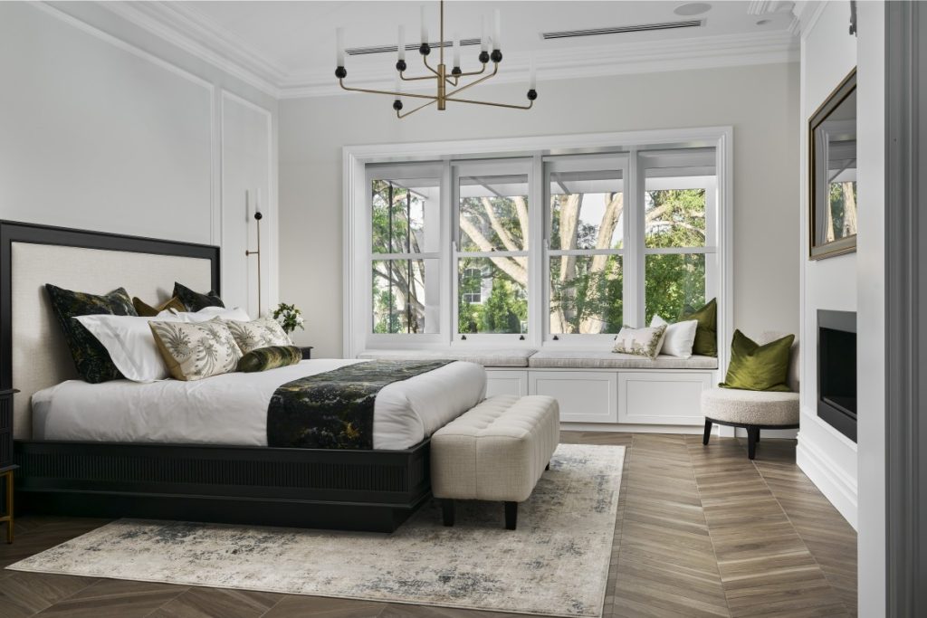 Bedroom with wooden sash windows. Photo credit Cedar West