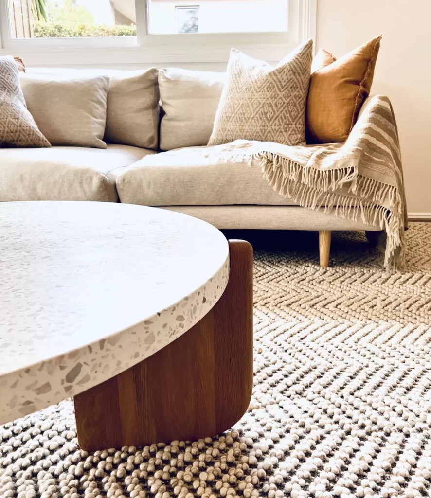 textured rug, throw and cushions styled in a home in Balgowlah Sydney