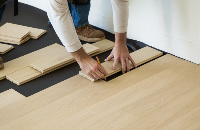 laying wooden flooring
