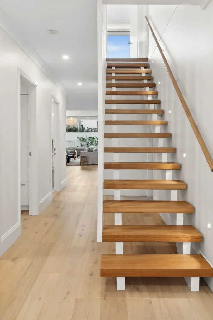 warm wooden stairs in a full home renovation