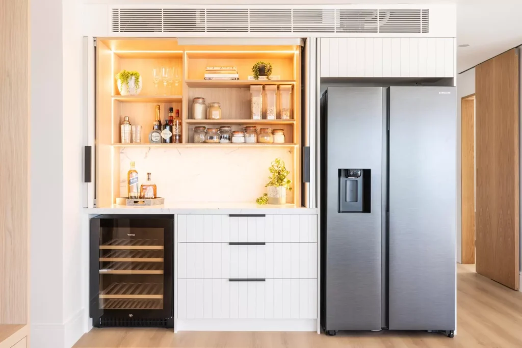 custom designed bar with inbuilt lighting in a full apartment renovation in Manly Sydney