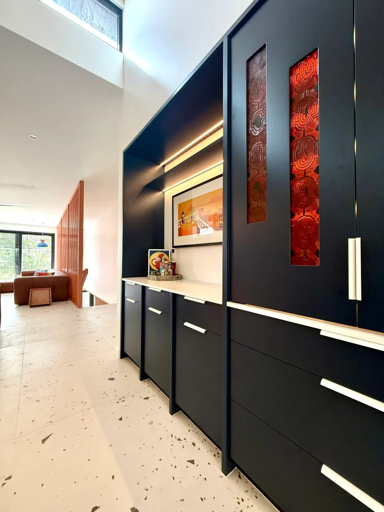 A custom designed cabinetry with feature doors which incorporate a home bar in a new build home in manly vale