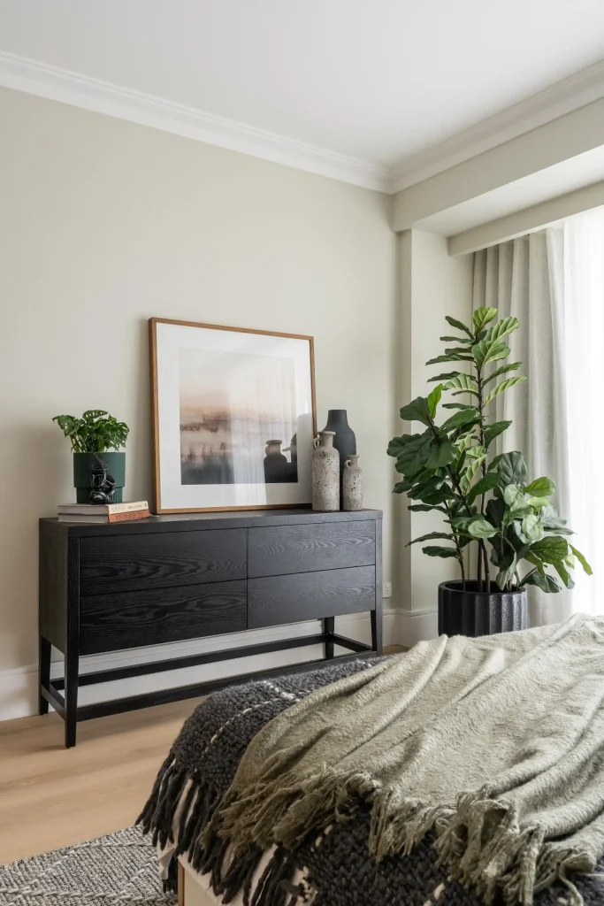 Cool green walls with black accessories in a bedroom in Manly