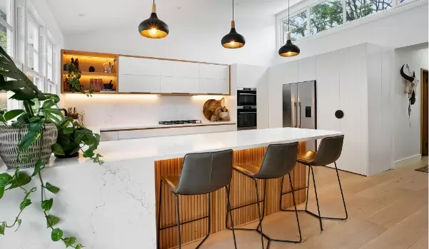 White kitchen with wood an black highlights in full home renovation in Manly Vale
