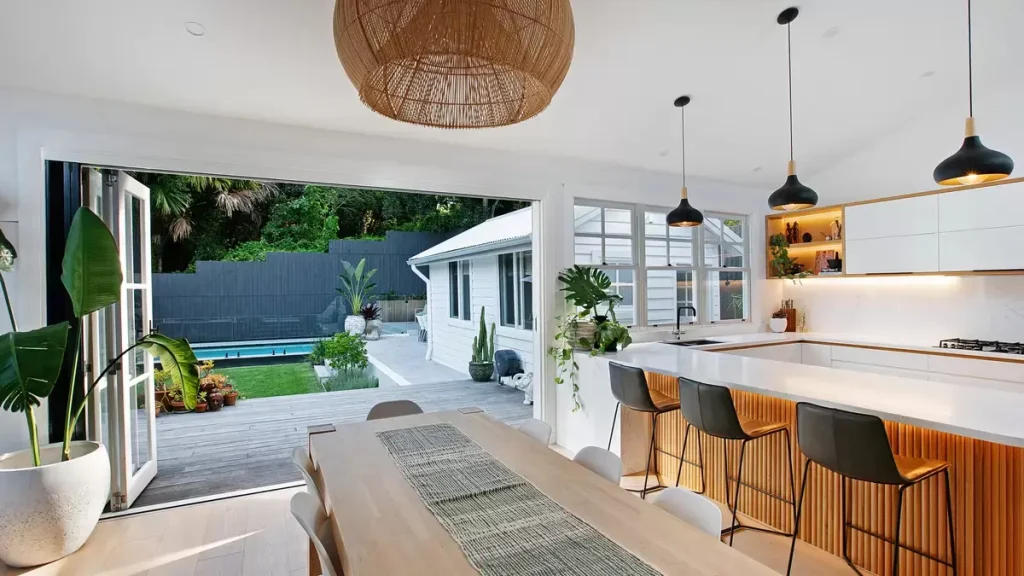 warm tones in the open plan kitchen / dining room in  a full home renovation in Manly Vale